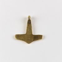 Reverse view of a gold hammer-shaped pendant commonly known as a Thor's hammer