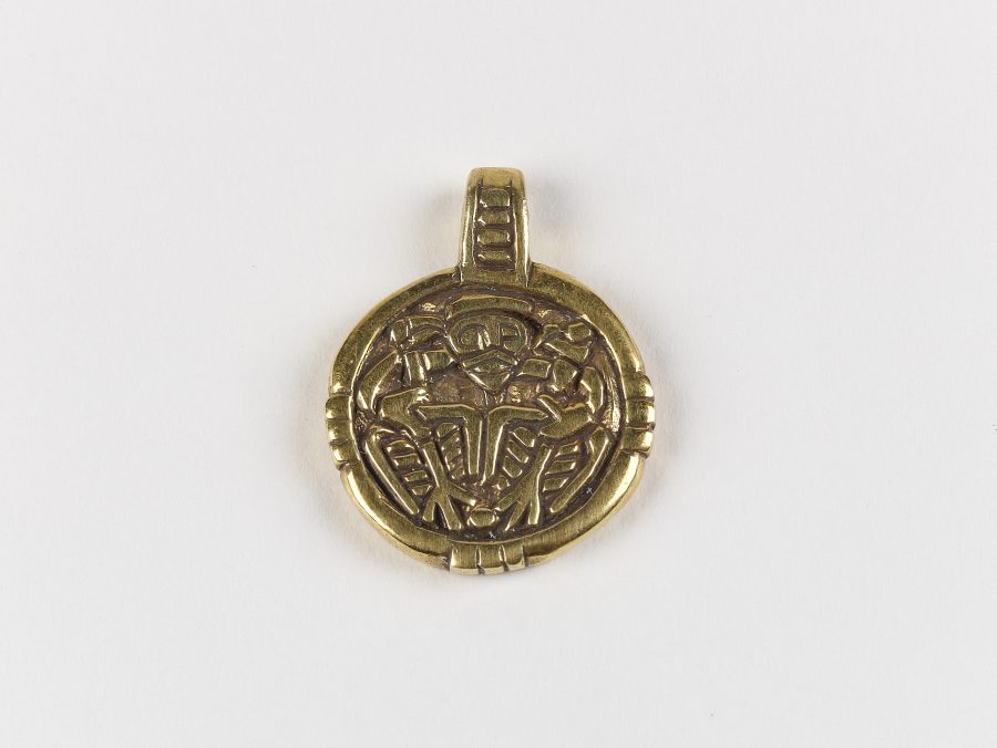 The front side of a pendant depicting Odin and his ravens