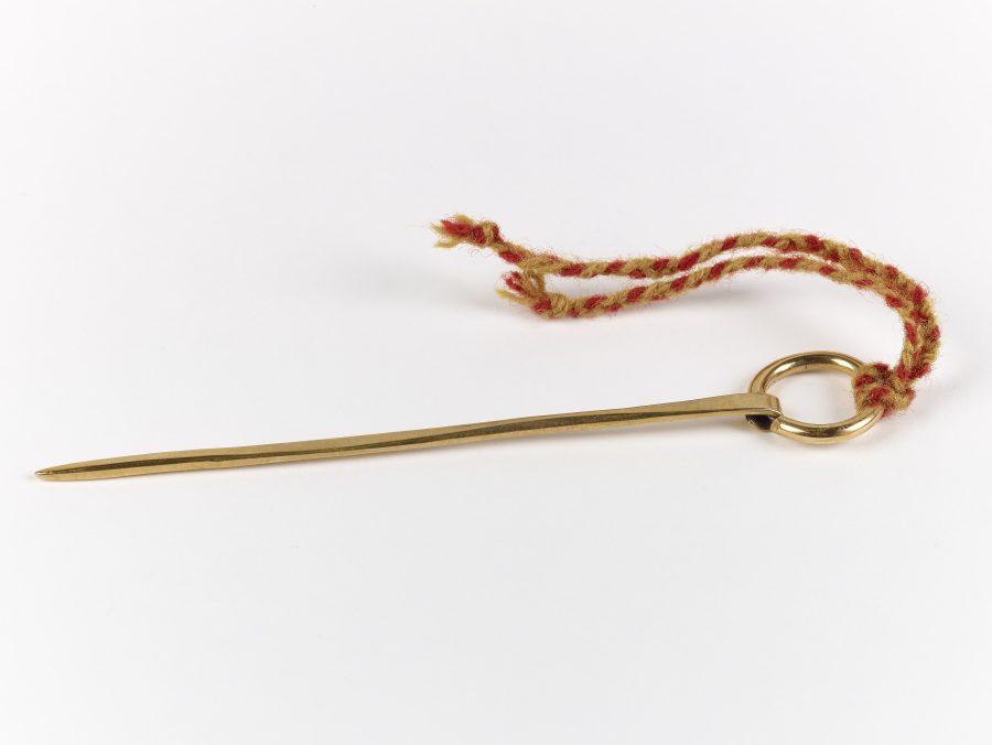 A reproduction copper alloy ring-headed pin