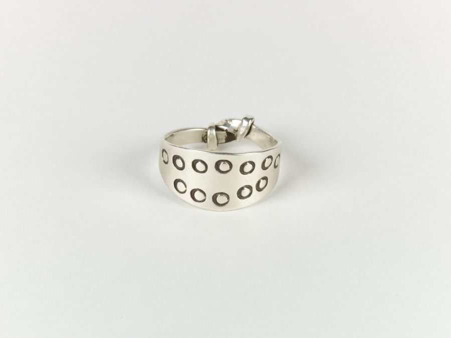 A reproduction stamped silver ring
