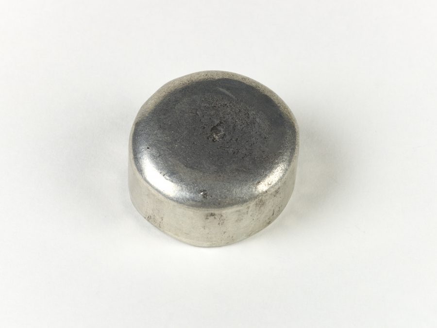A reproduction round lead weight based on an original found in Brampton, Lincolnshire.