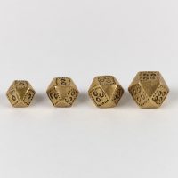 A group of four copper alloy, polyhedral weights