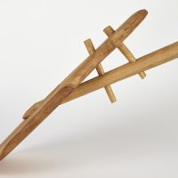 Detail of the blade of a reproduction wooden shovel showing how it attaches to the shaft