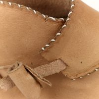 Detail of fastening peg on side of shoe