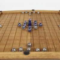 Reproduction game board with pieces laid out on it