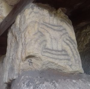 Stone fragment with ring-chain ornament