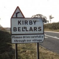 Village sign showing the name Kirby Bellars