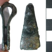 A copper-alloy suspension loop for a sword belt found at Heath Wood, Ingelby, Derbyshire. (c) Derby Museum and Art Gallery