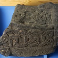 A recumbent grave marker of the type known as a hogback found near St. Alkmund's church in Derby, Derbyshire. (c) Derby Museum and Art Gallery