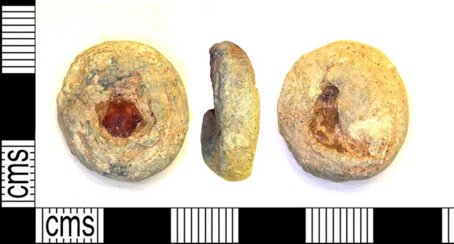 A lead-alloy weight with encrusted stone found near Shepshed, Leicestershire. (c) Portable Antiquities Scheme, CC BY-SA 2.0